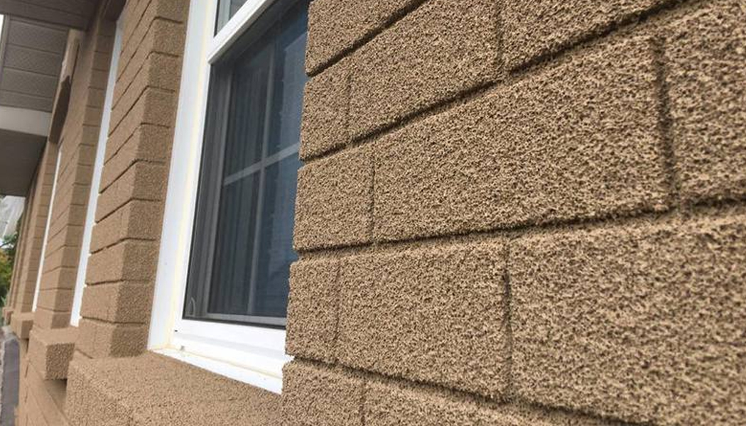 Fachada con pintura de corcho antihumedades con efecto aislante para exteriores e interiores